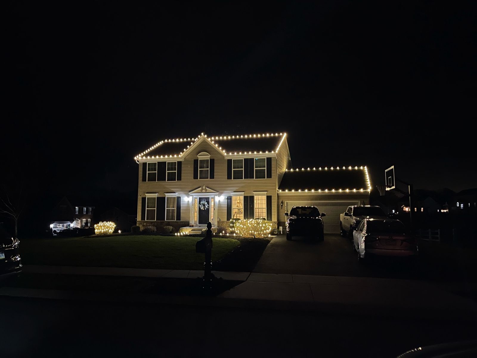 Holiday light installation with multicolor accents