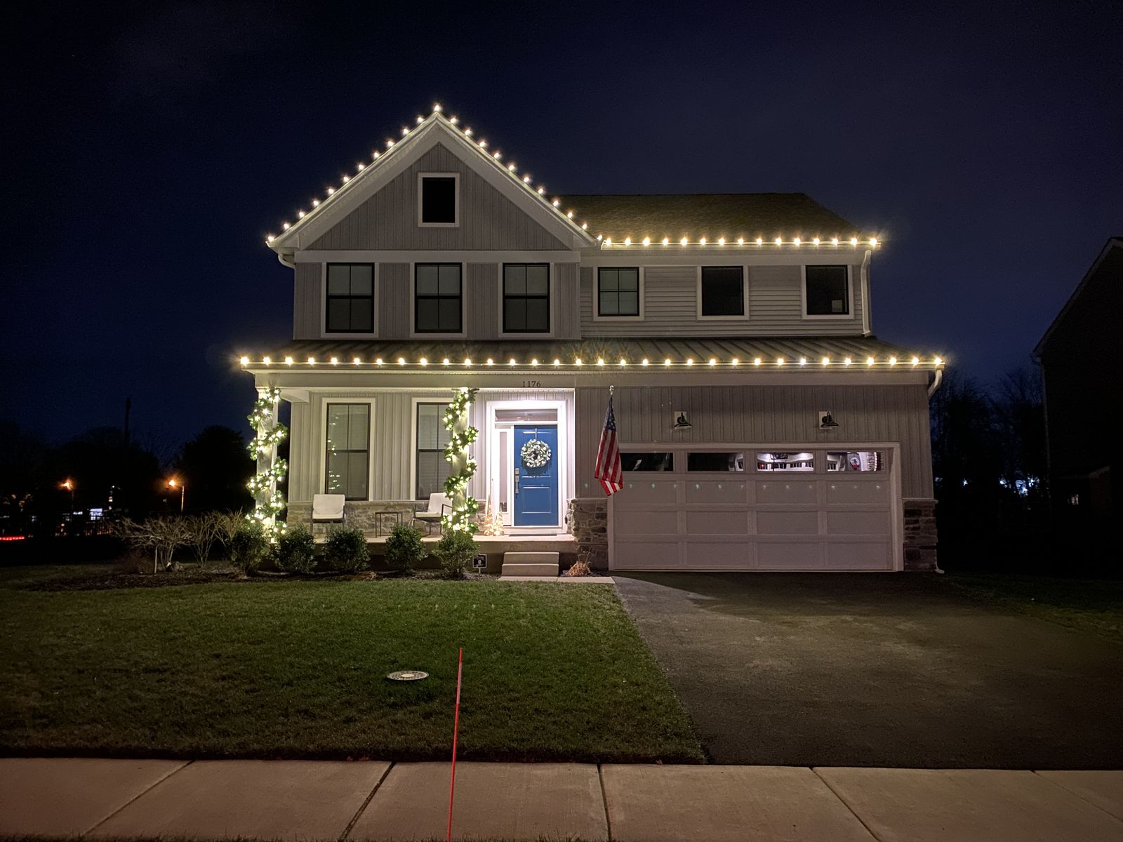 Holiday display with roofline and landscape accents