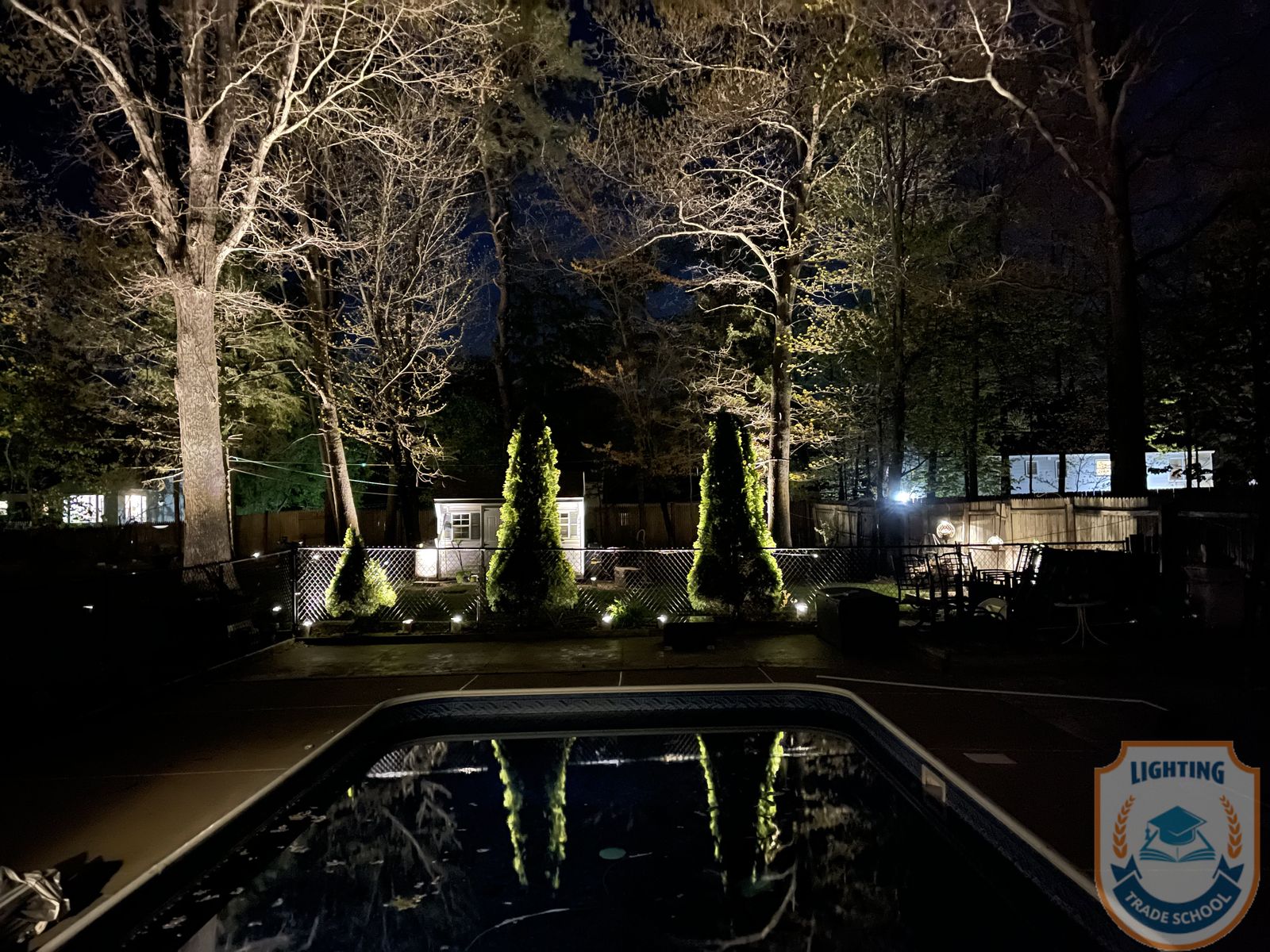 Landscape lighting with pathway and garden bed focus
