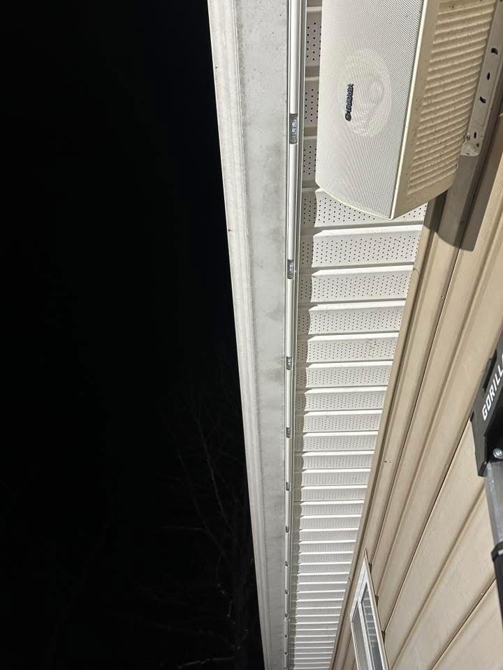 Permanent LED track lighting on soffit at night